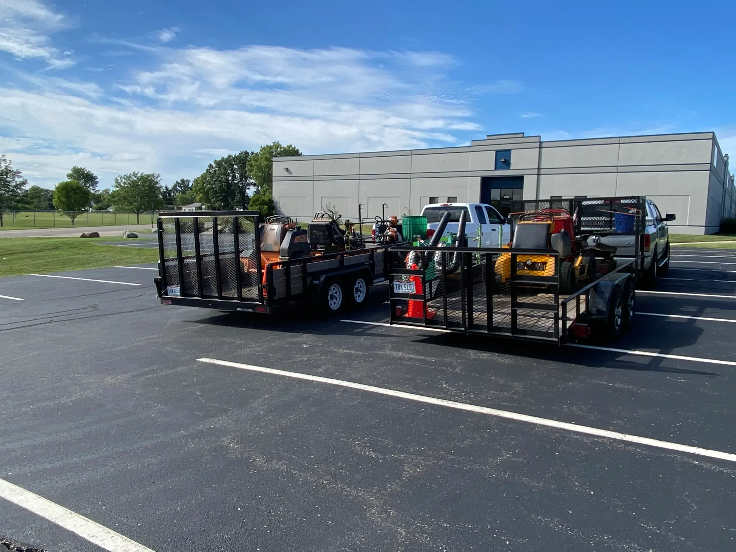 JBH Landscaping's trucks and equipment trailers loaded for the day's jobs