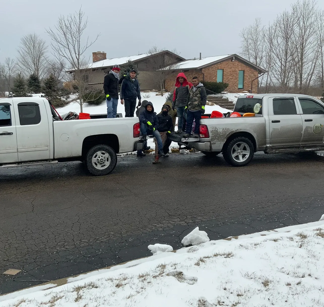 The JBH Landscaping crew loading trucks for a snow clearing job